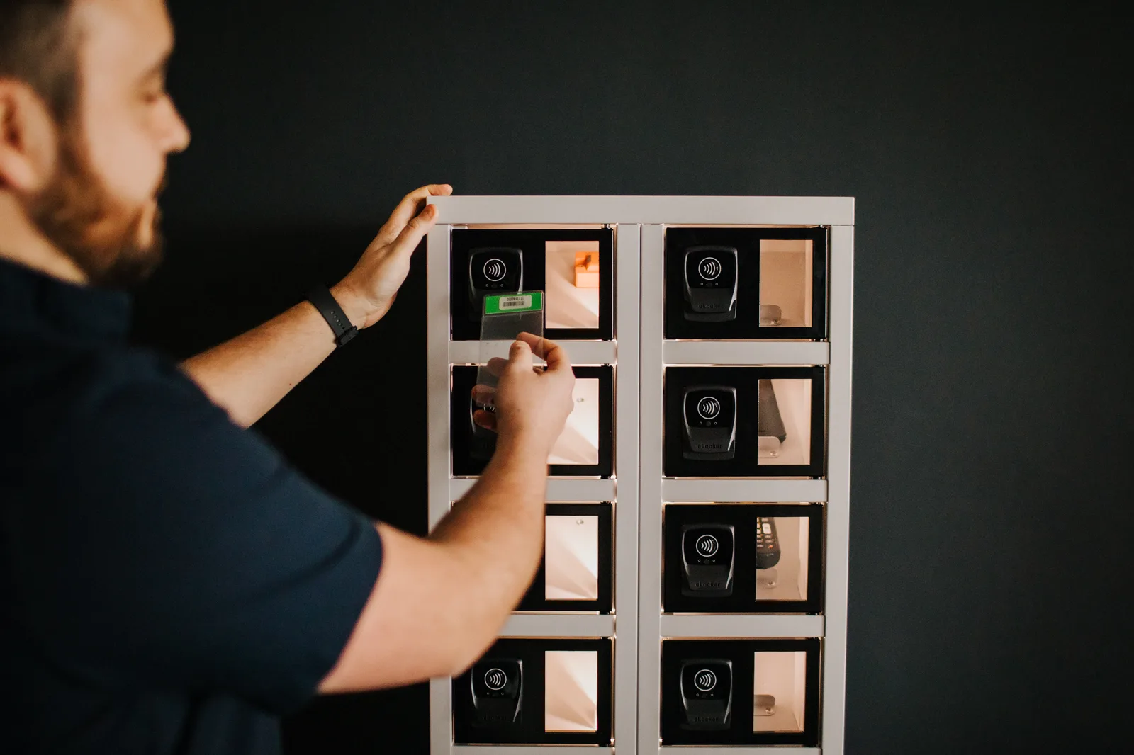 Worker badging in at the locker bank reader