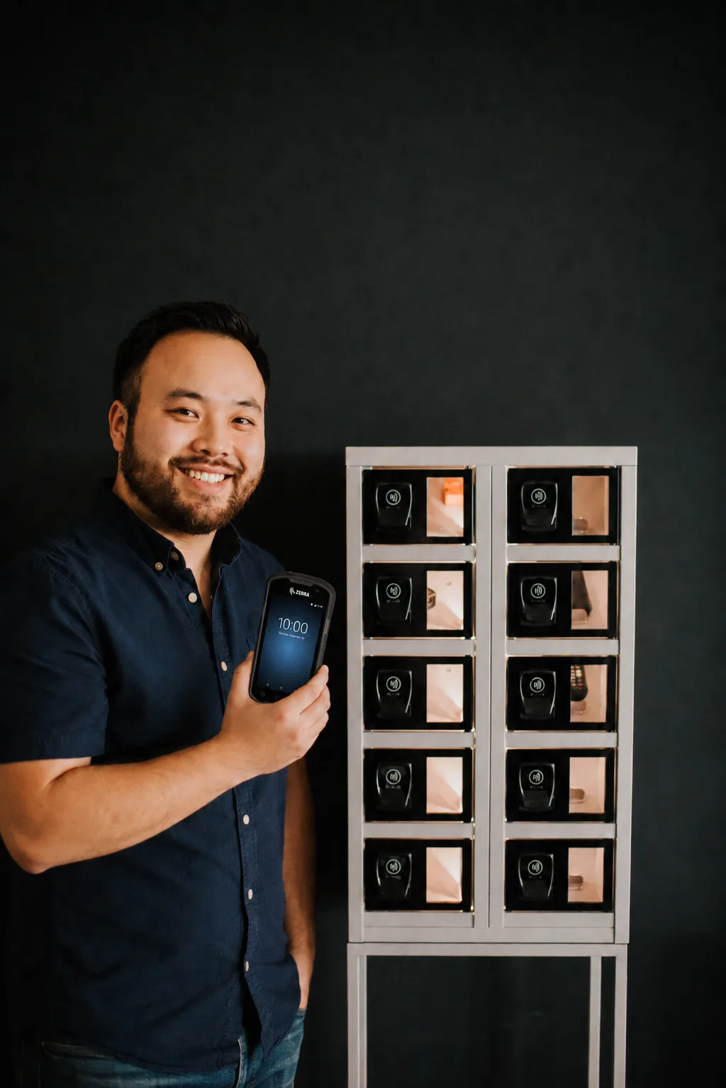 Warehouse worker collecting a device from an eLocker locker