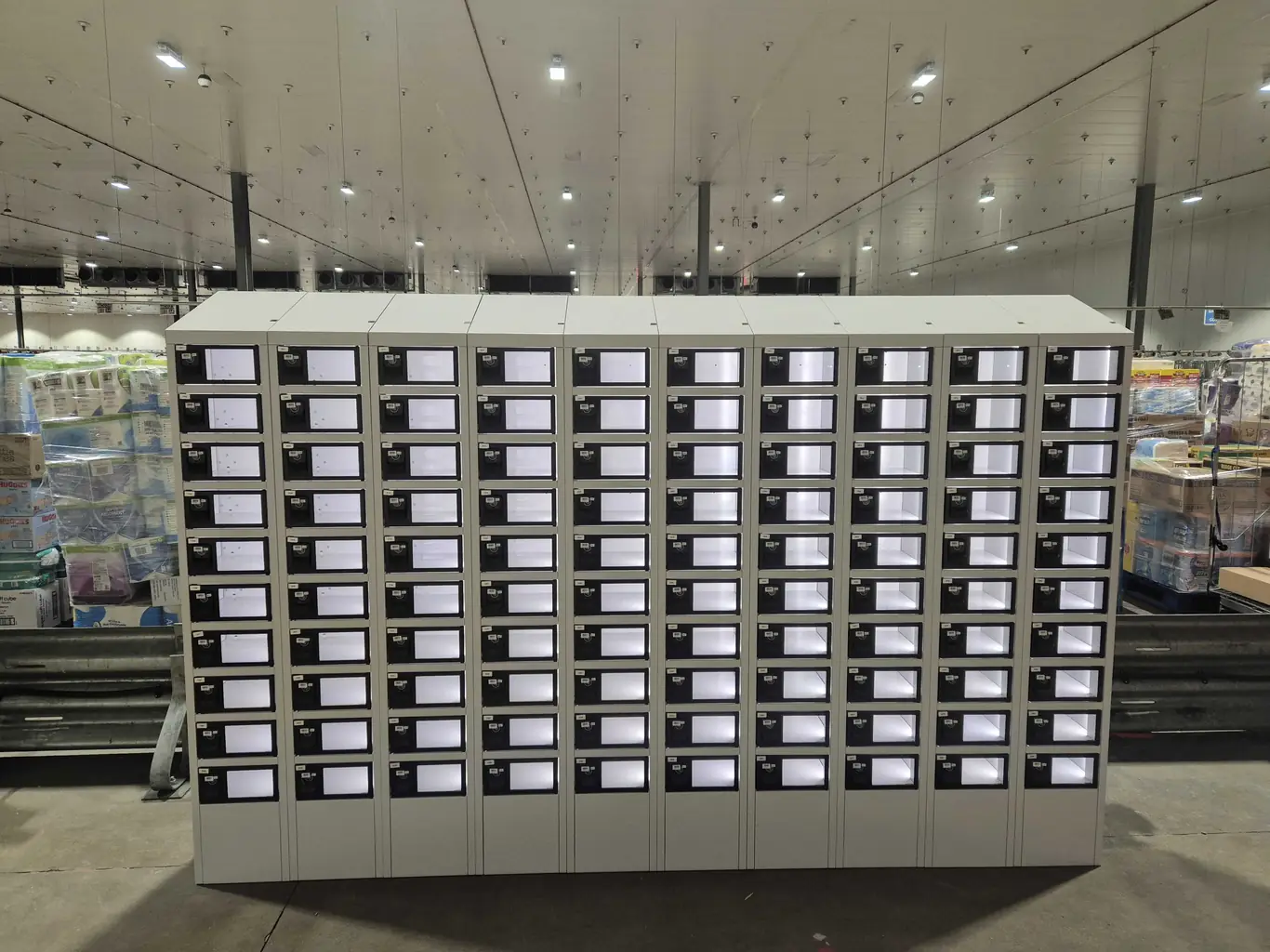 A free-standing battery-powered eLocker bank on an open warehouse floor